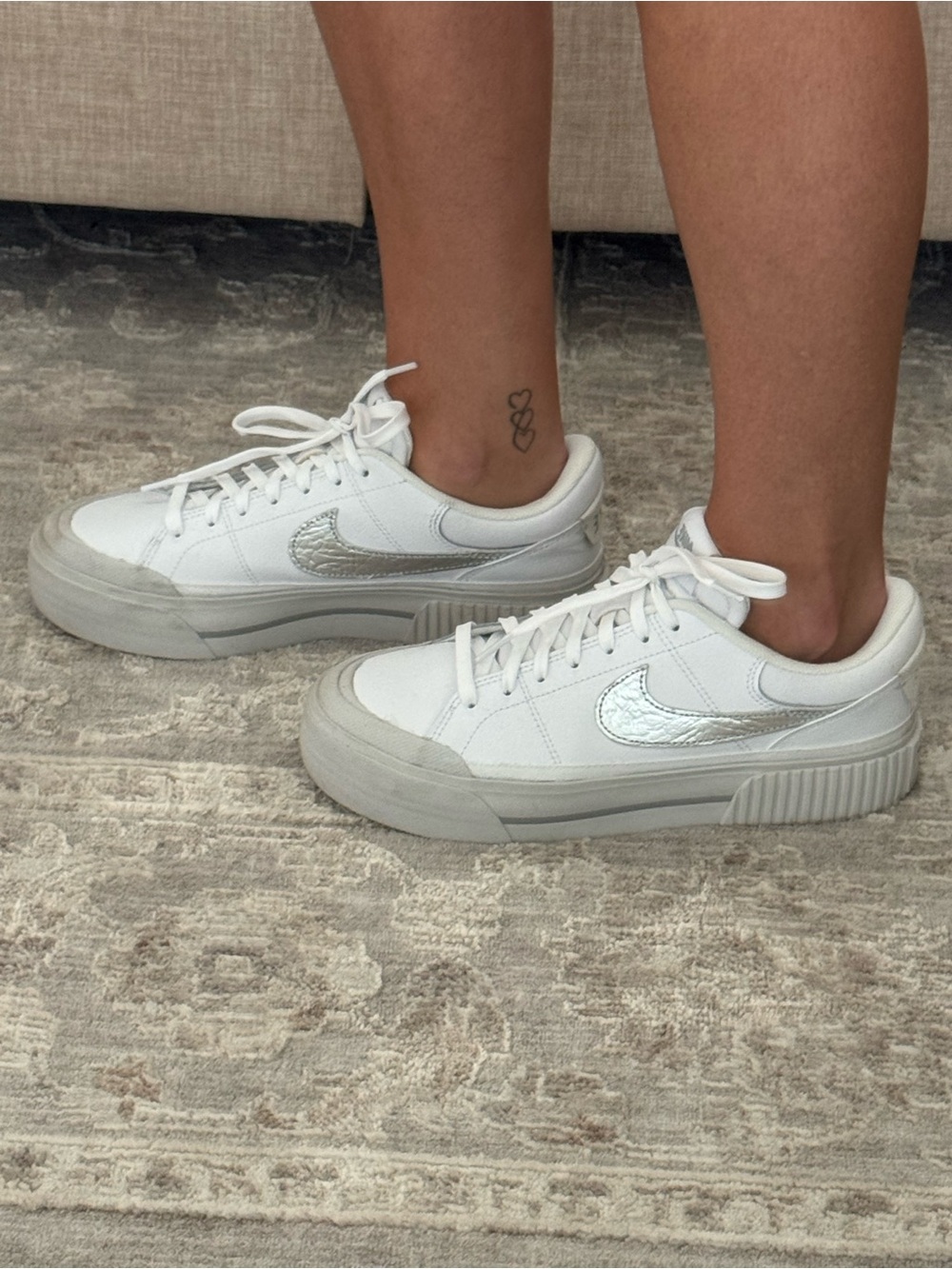 Nike Women's White Sneakers with Silver Swoosh